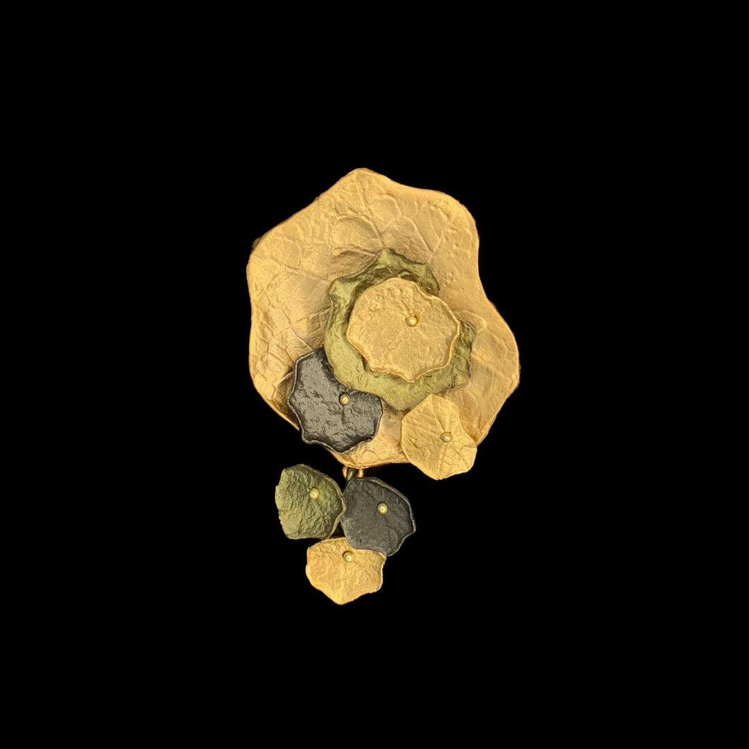 Image of the Michael Michaud Nasturtium Brooch on a black background