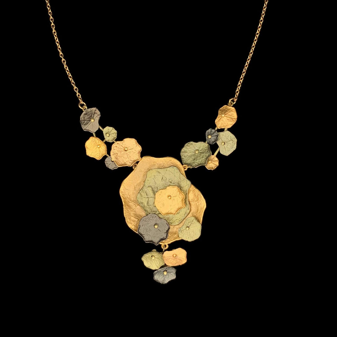 Image of the Michael Michaud Nasturtium Necklace on a black background
