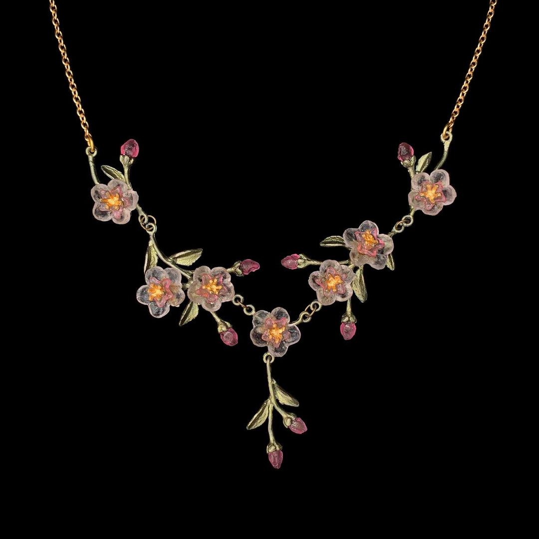 Image of the Michael Michaud Peach Blossom Necklace on a black background