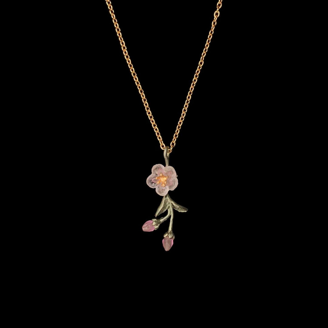 Image of the Michael Michaud Peach Blossom Pendant - Dainty Flower on a black background