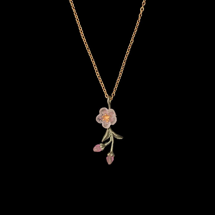 Image of the Michael Michaud Peach Blossom Pendant - Dainty Flower on a black background