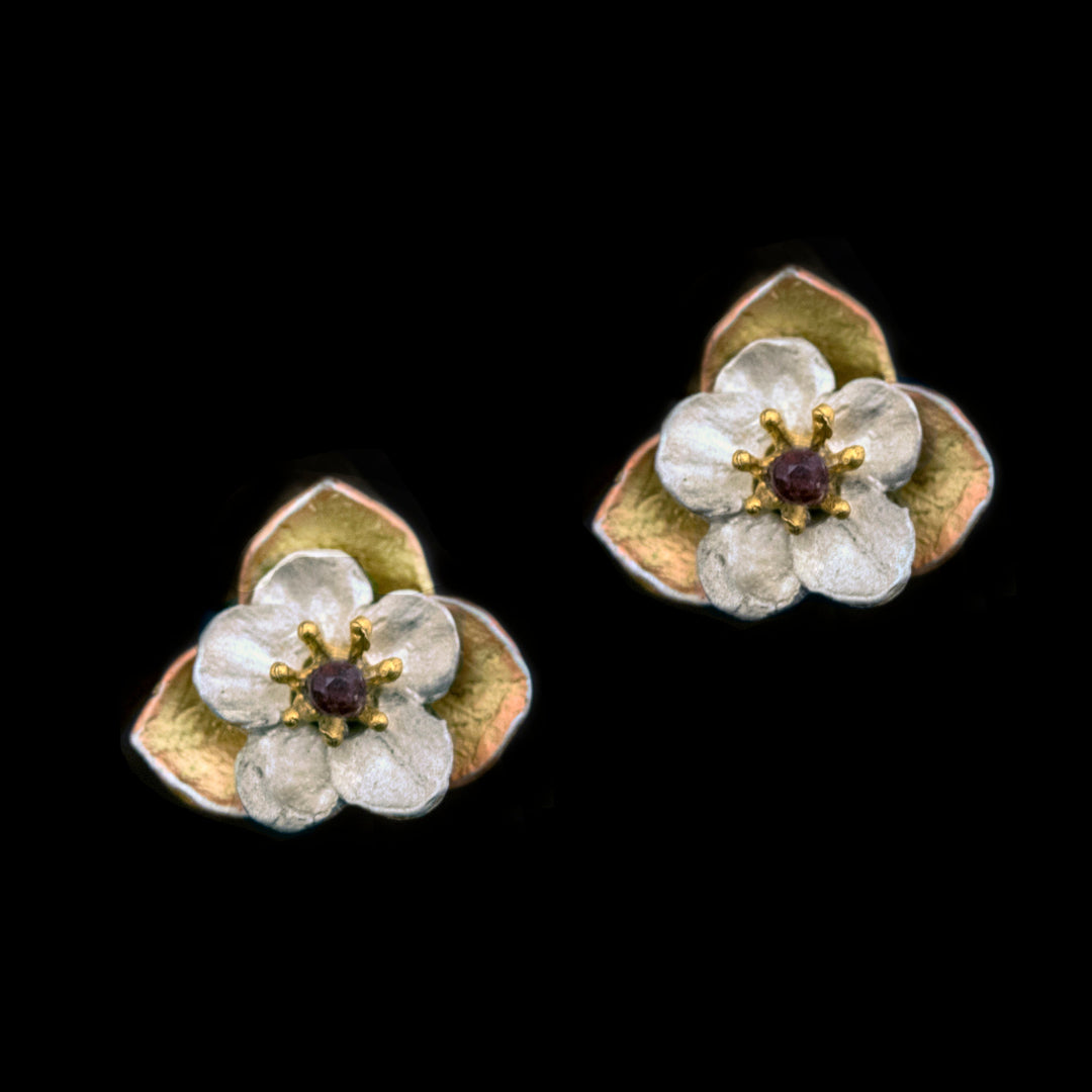Image of the Michael Michaud Fine Survivor Tree Flower Post Earrings on a black background