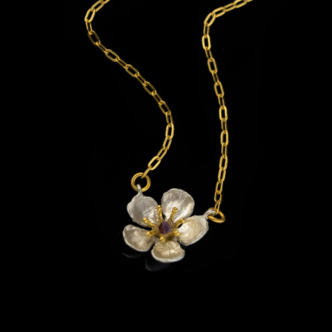 Image of the Michael Michaud Fine Survivor Tree Flower Pendant on a black background