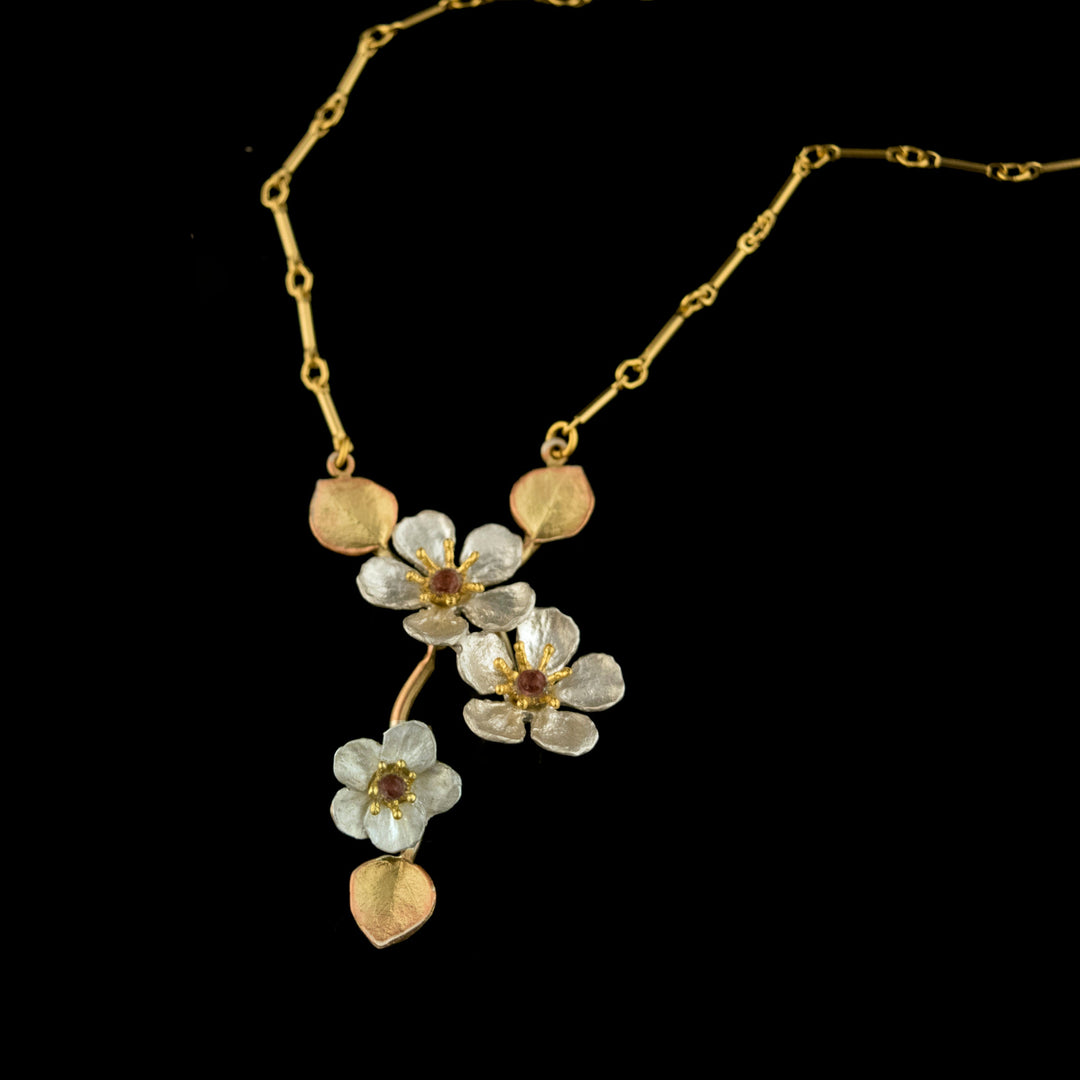 Image of the Michael Michaud Fine Survivor Tree Pendant on a black background