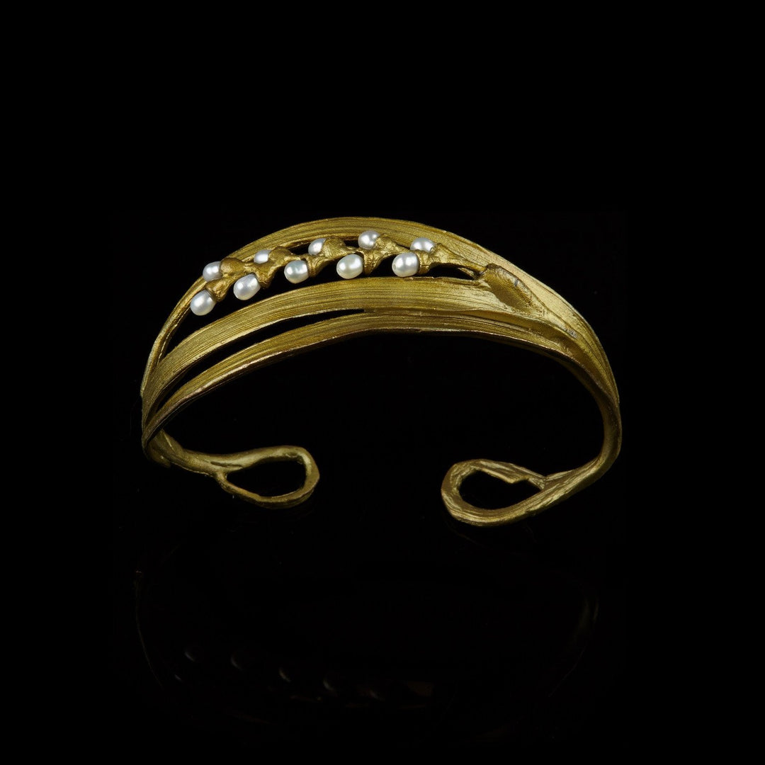 Image of the Michael Michaud Rice Cuff on a black background
