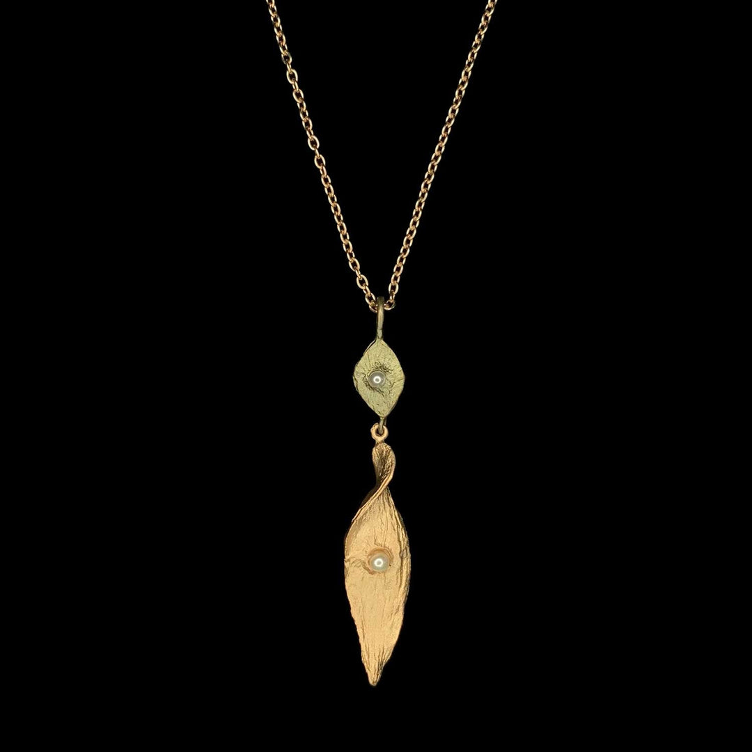 Image of the Michael Michaud Spiral Pod Pendant on a black background