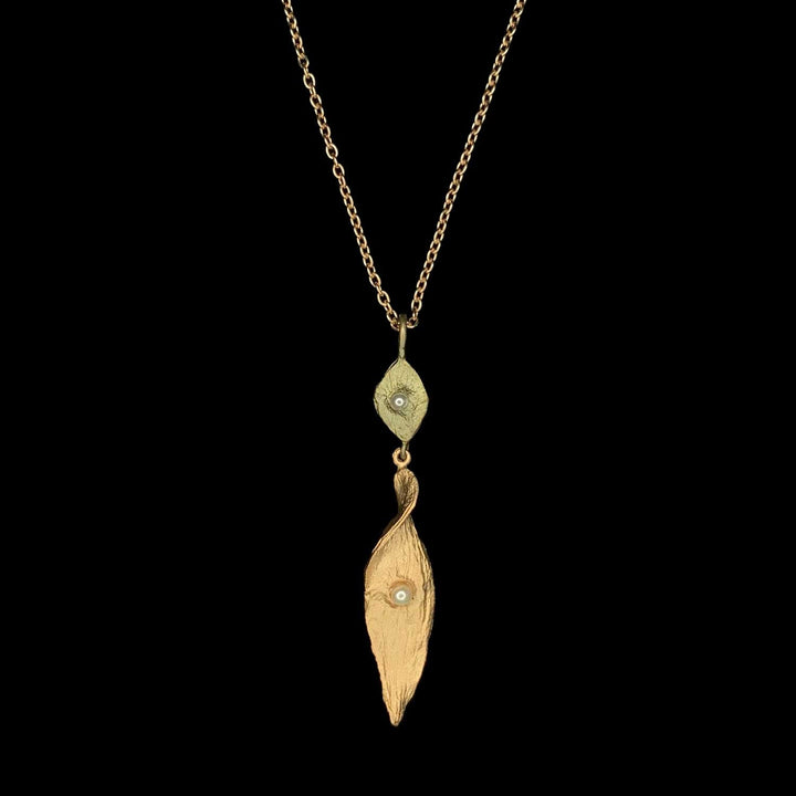 Image of the Michael Michaud Spiral Pod Pendant on a black background