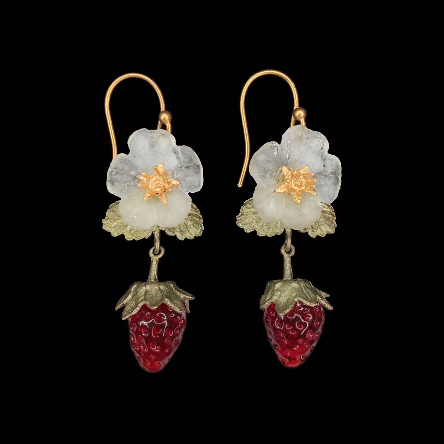 A pair of earrings featuring a floral design with a red strawberry at the bottom, crafted from hand patinated bronze with flame-worked red glass berries and 24kt gold plated centers, on gold-colored wires.