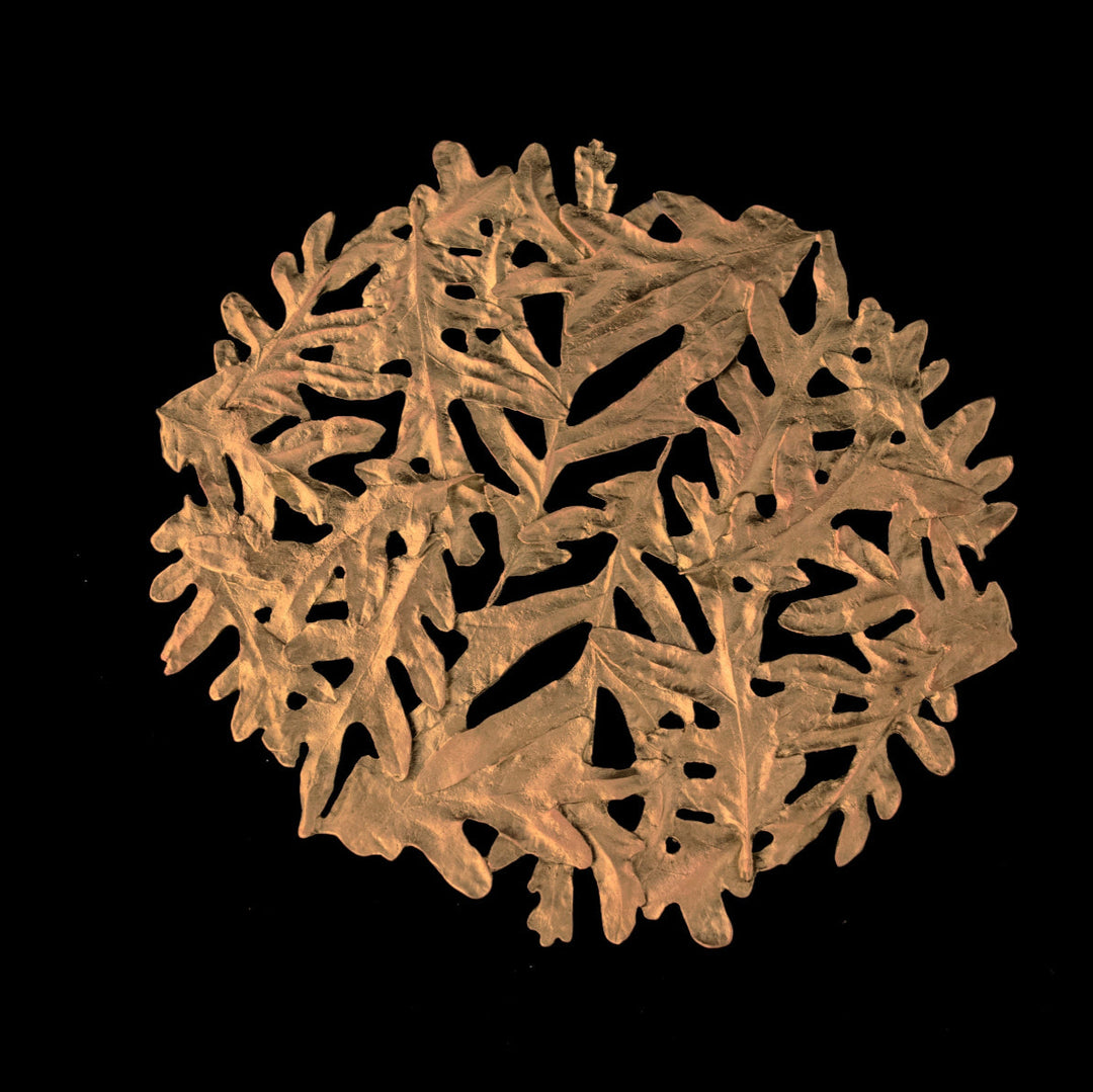 Image of the Michael Michaud Oak Leaf Trivet on a black background