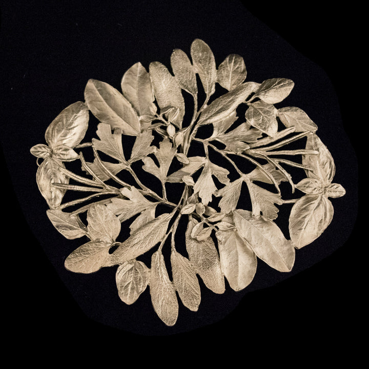 Image of the Michael Michaud Herb Trivet - Pewter on a black background