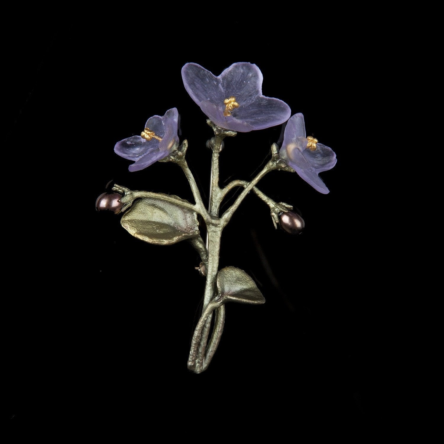 Image of the Michael Michaud African Violet Brooch on a black background
