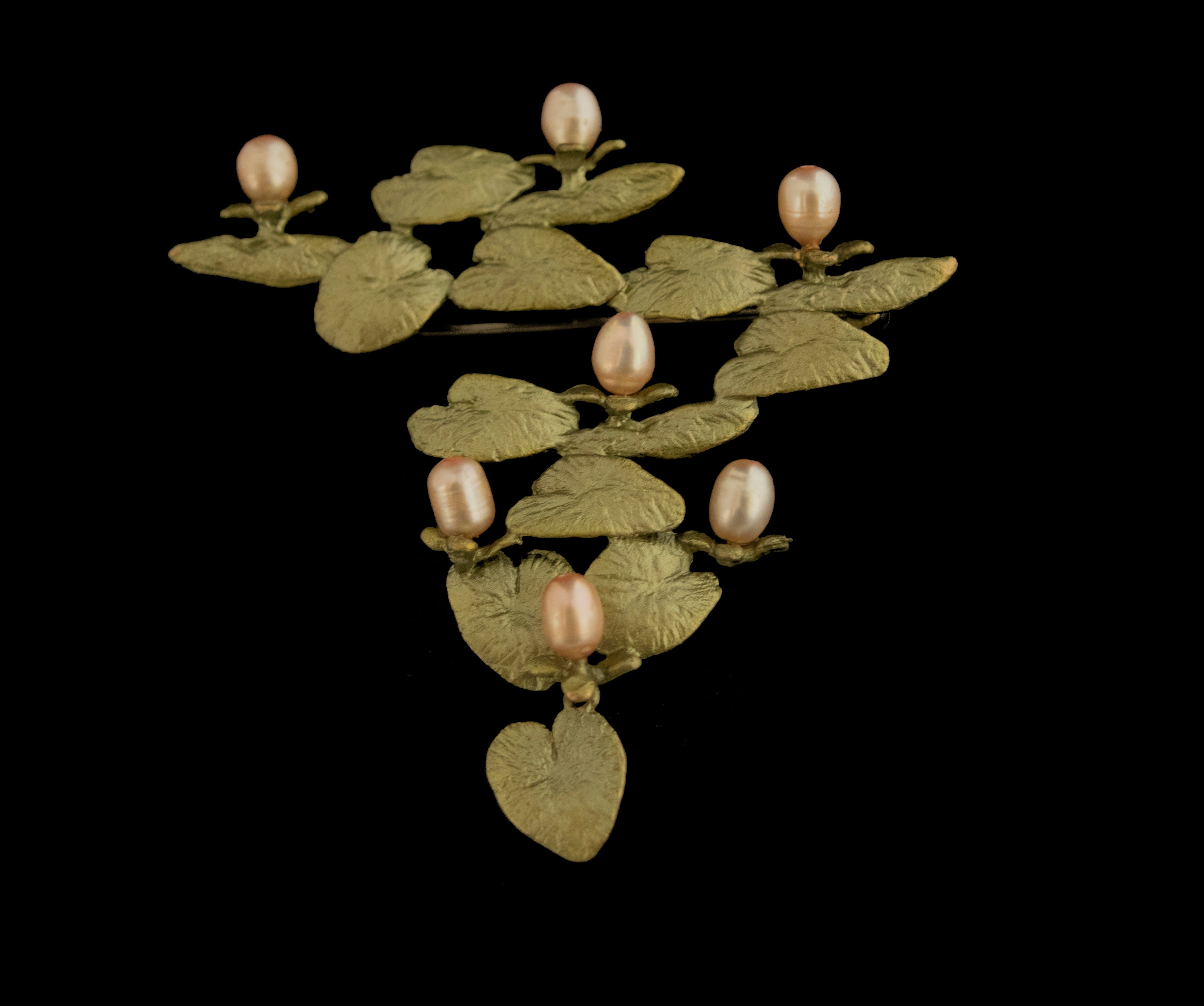 Image of the Michael Michaud Water Lilies Brooch on a black background