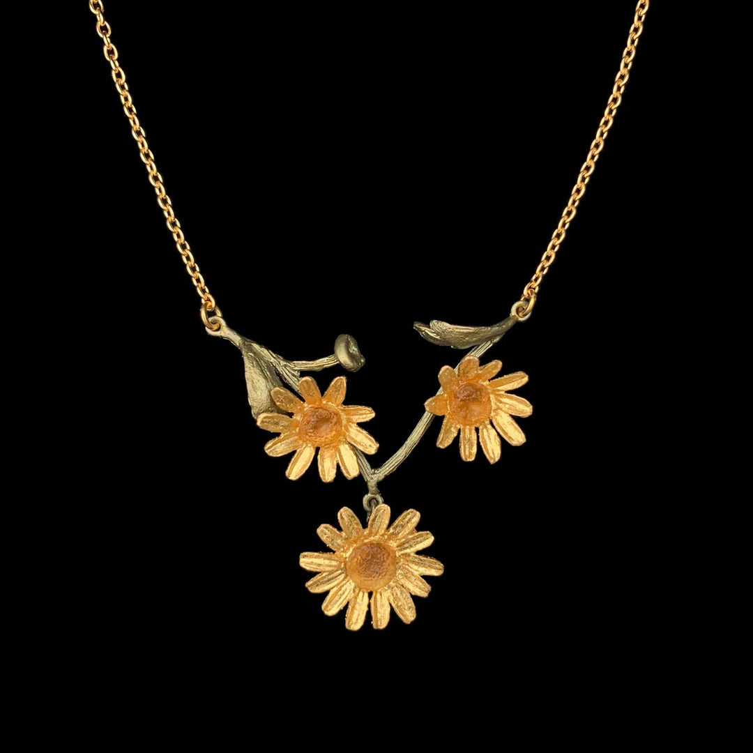 Image of the Michael Michaud Golden Butter Daisy Necklace on a black background