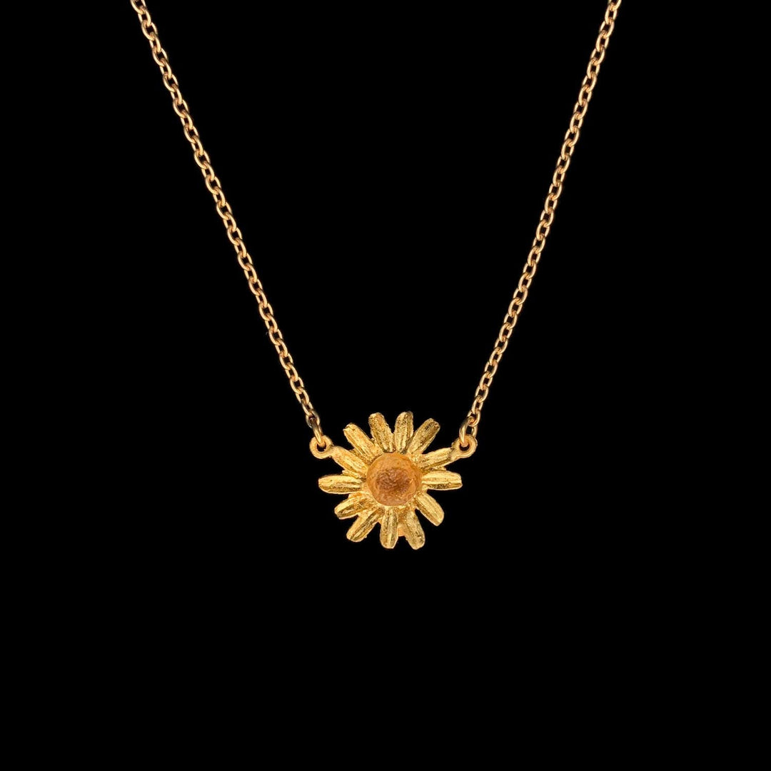 Image of the Michael Michaud Golden Butter Daisy Pendant on a black background