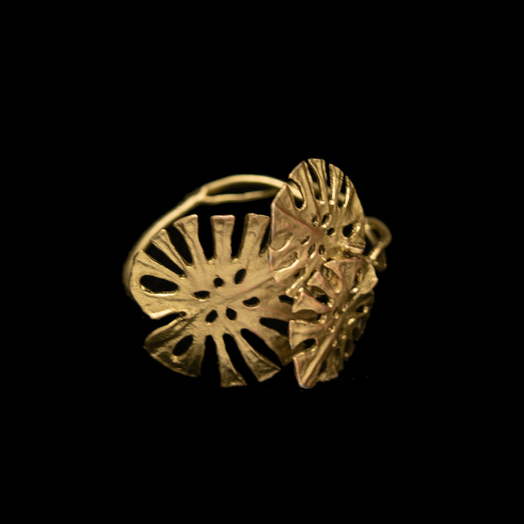 Image of the Michael Michaud Monstera Napkin Rings - Set of 4 on a black background