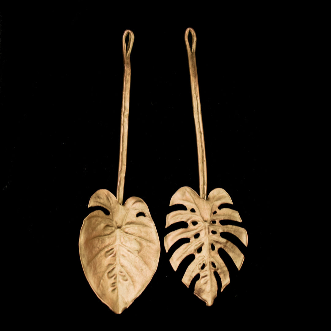 Image of the Michael Michaud Monstera Serving Set of 2 on a black background